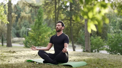 Person practicing morning meditation in peaceful setting